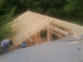 Framing a new roof addition that ties into an existing shingle roof in New River